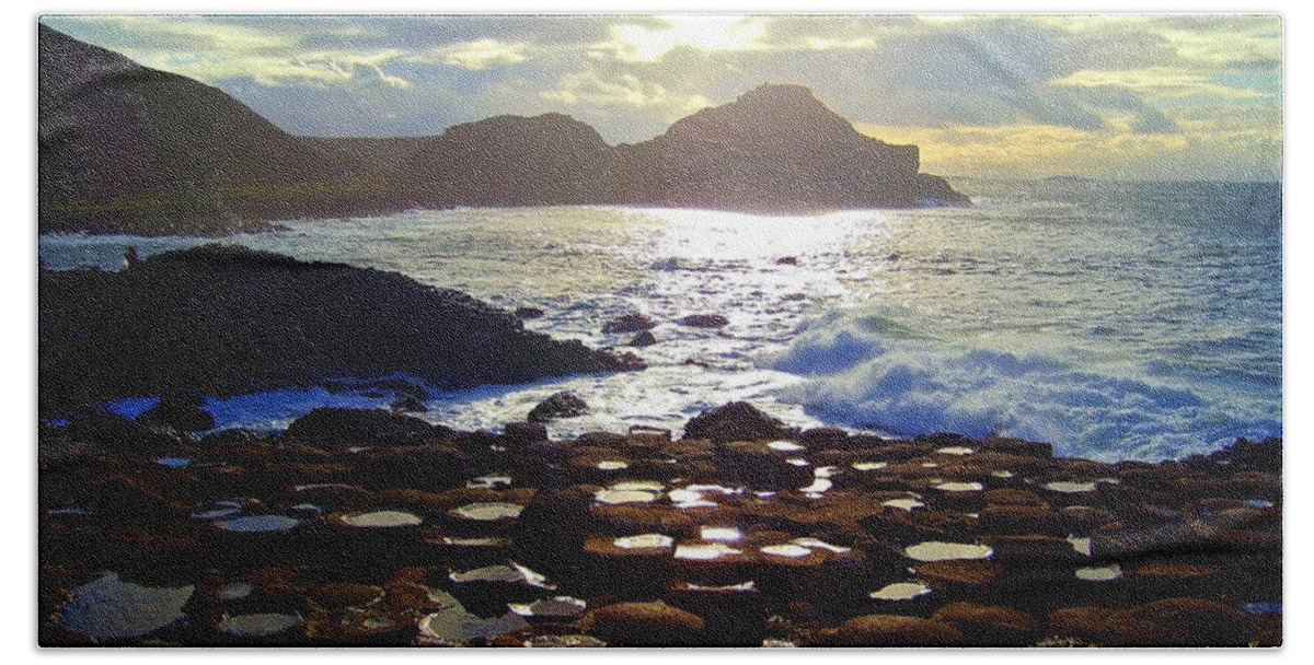 Giant's Causeway Beach Towel featuring the photograph sunset at Giant's Causeway by Nina Ficur Feenan