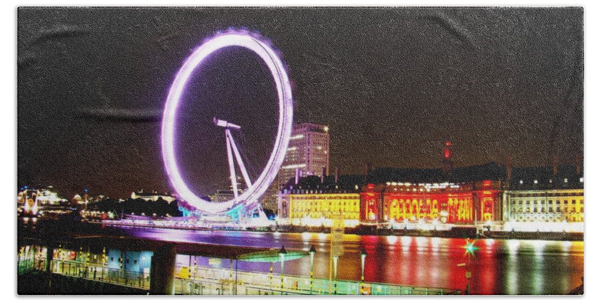 The London Eye Beach Towel featuring the photograph The Eye in Colors by Zinvolle Art