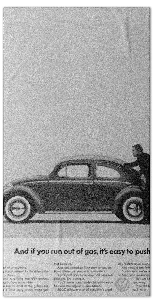 Vw Beetle Beach Towel featuring the digital art VW Beetle Advert 1962 - And if you run out of gas it's easy to push by Georgia Fowler
