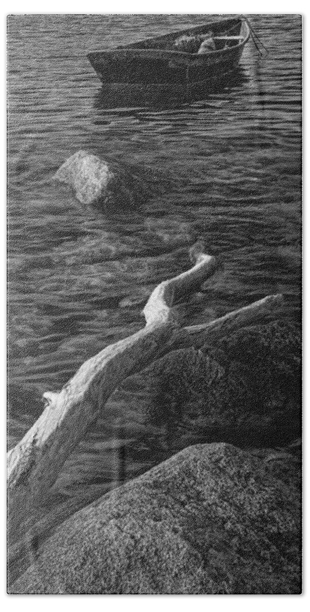 Boat Beach Sheet featuring the photograph Black and White Photograph of a row boat anchored near a rocky shore by Randall Nyhof