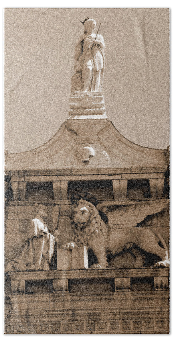 Sepia Beach Towel featuring the photograph Lion of Venice Between Spires by Donna Corless