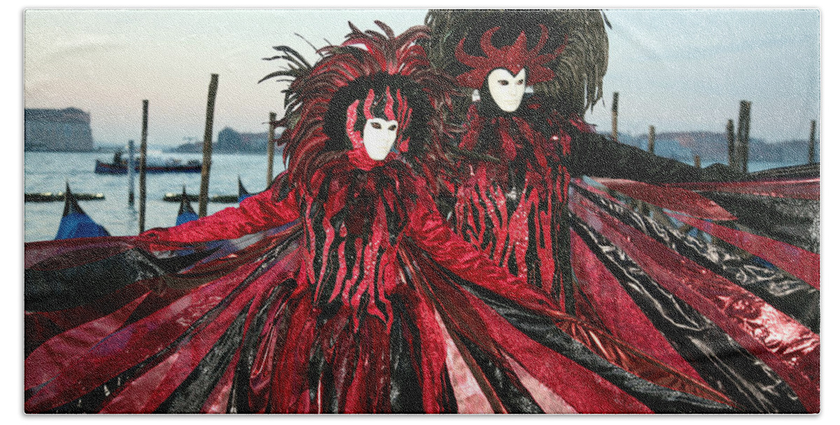 Venice Carnival Beach Towel featuring the photograph Red and Black Winged Couple at Sunrise by Donna Corless