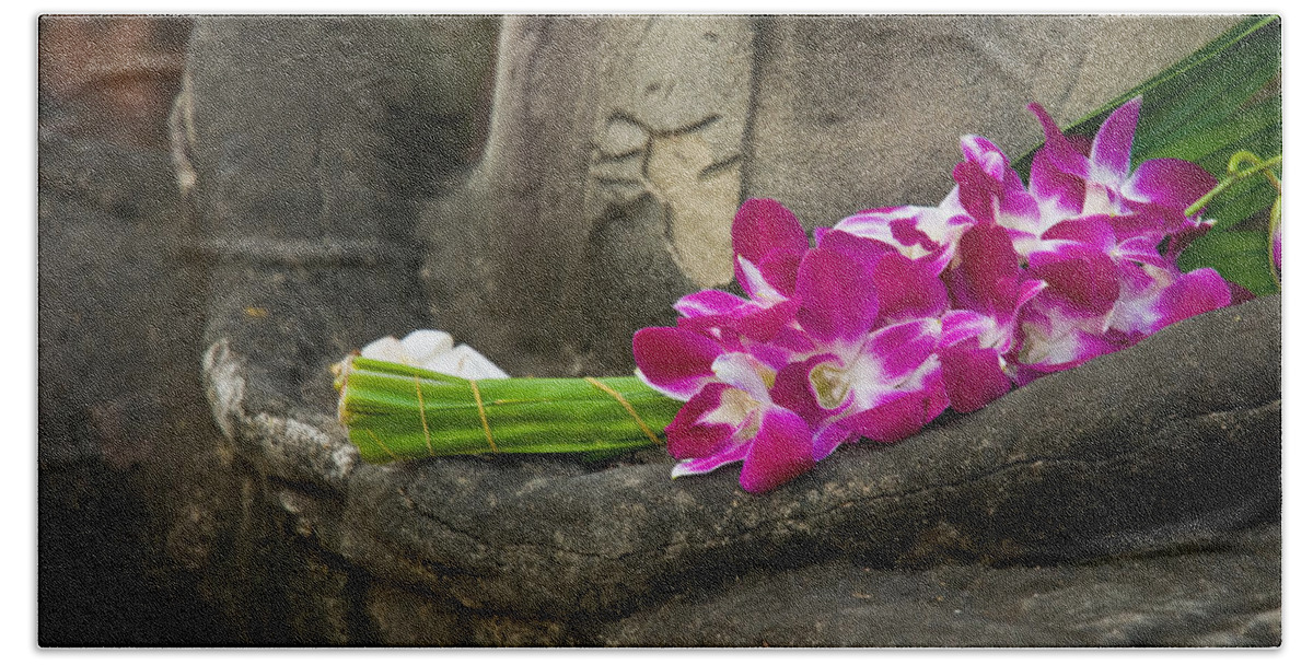 Ancient Beach Towel featuring the photograph Sitting Buddha in meditation position with fresh Orchid flowers by U Schade