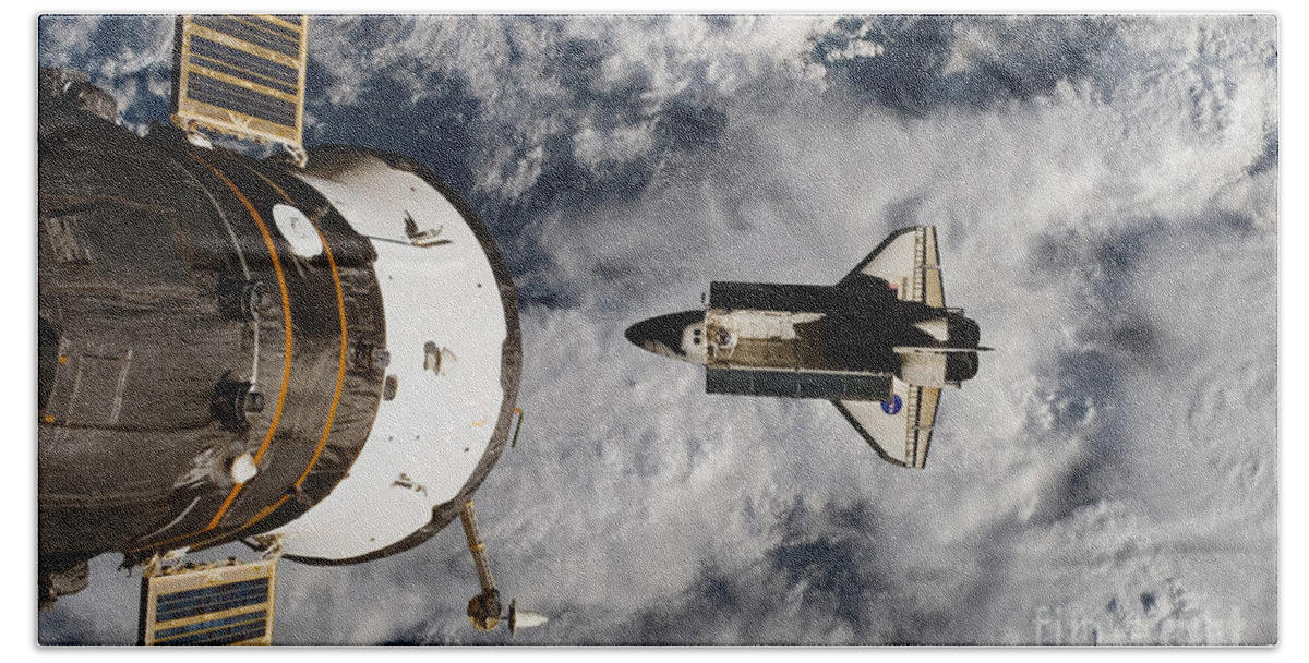 Space Beach Towel featuring the photograph Space Shuttle Atlantis Below Iss by Science Source