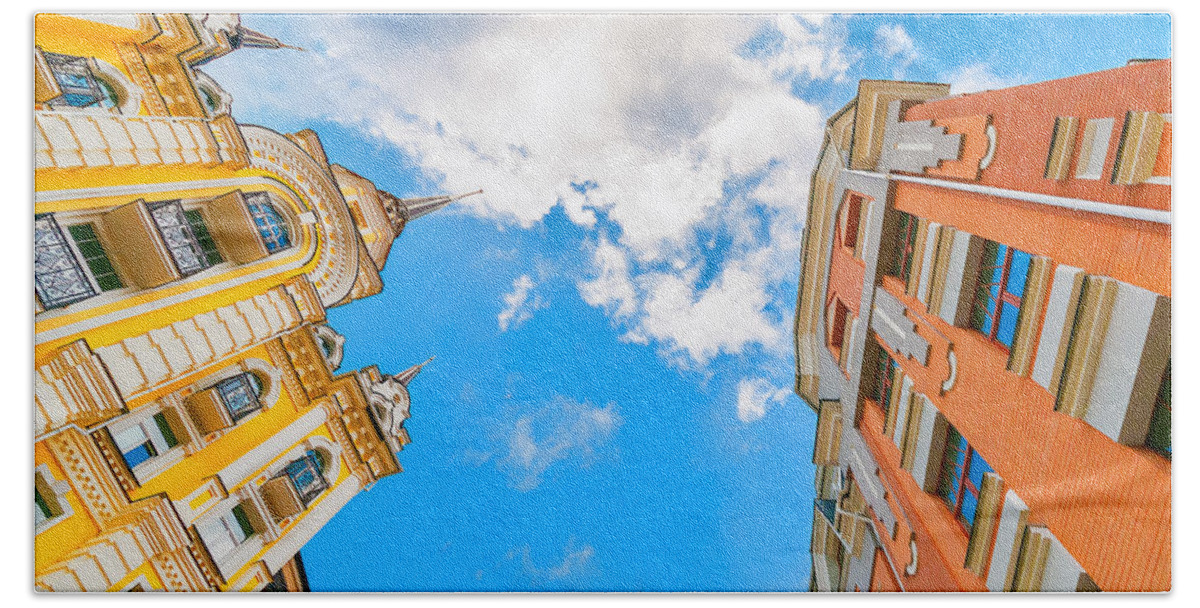 Estate Beach Towel featuring the photograph Looking up at tall colorfull residential building with clear sky #1 by Sergey Grishin