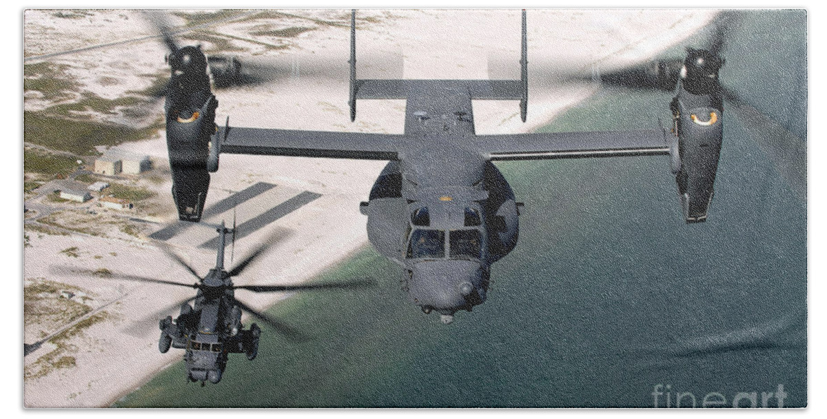 Airborne Beach Towel featuring the photograph A Cv-22 Osprey And An Mh-53 Pave Low by Stocktrek Images