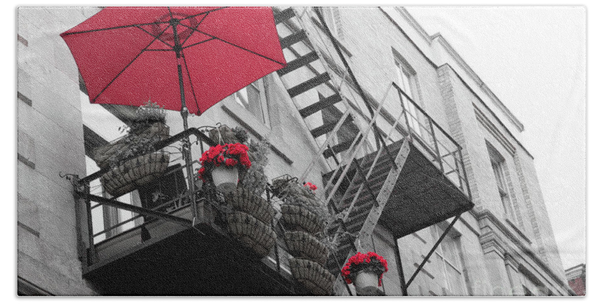 Canada Beach Towel featuring the photograph A red umbrella on a balcony by Agnes Caruso