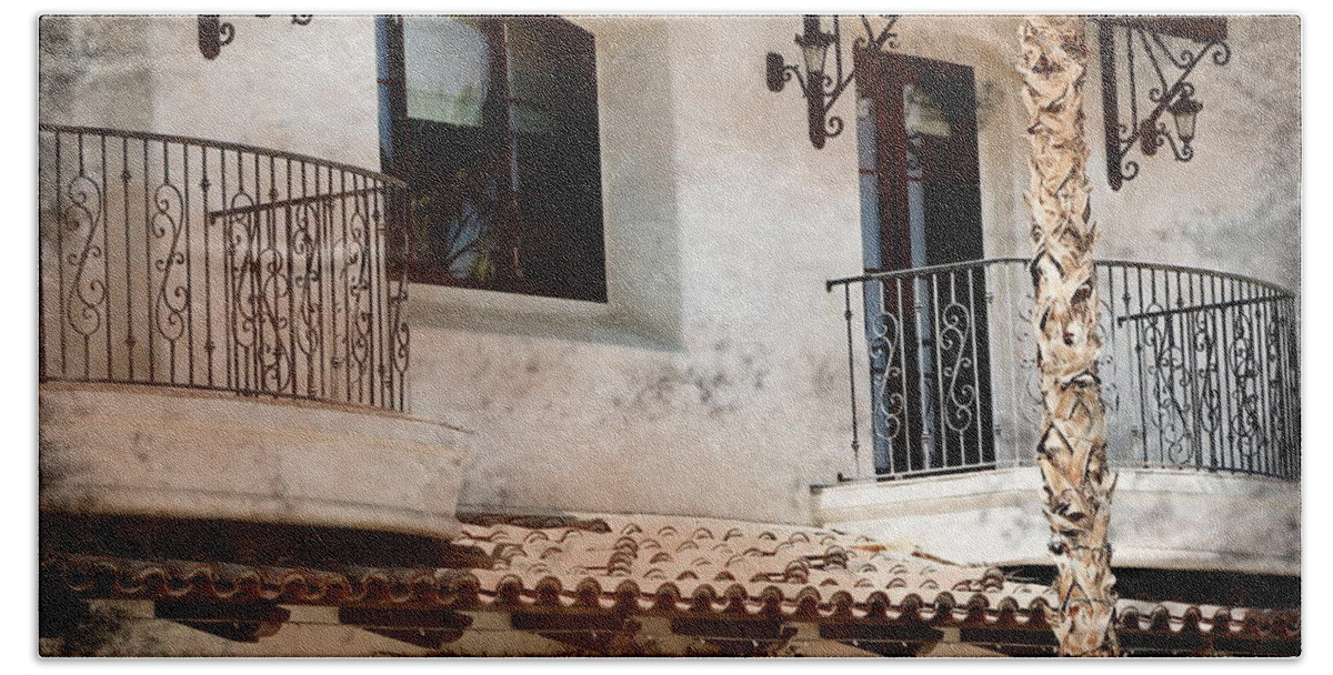 Aged Photograph Beach Sheet featuring the photograph Aged Stucco Building Balcony with Terracotta Roof by Colleen Cornelius