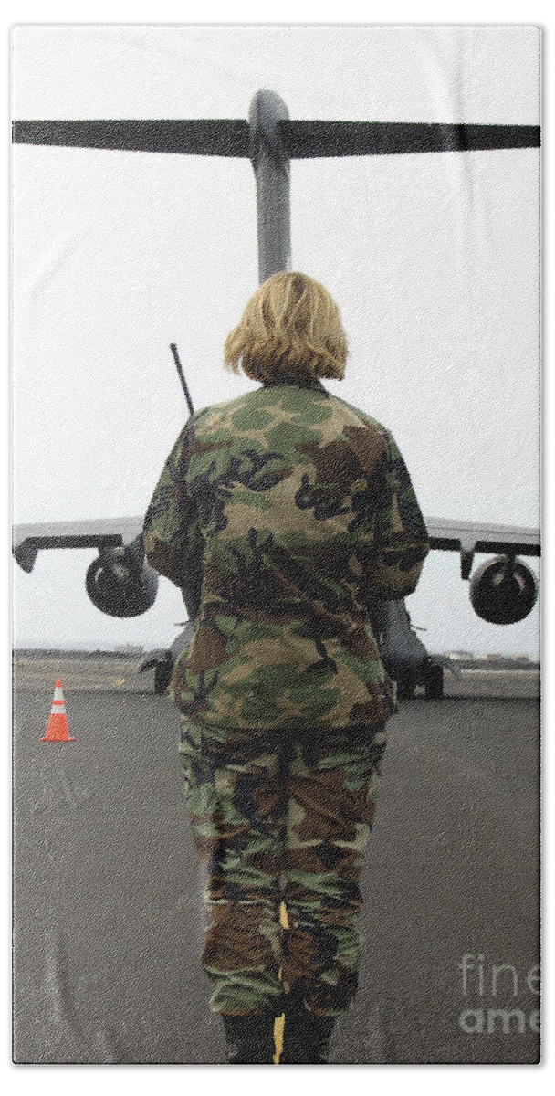 Aeromedical Beach Towel featuring the photograph An Airfield Manager Greets An Arriving by Stocktrek Images