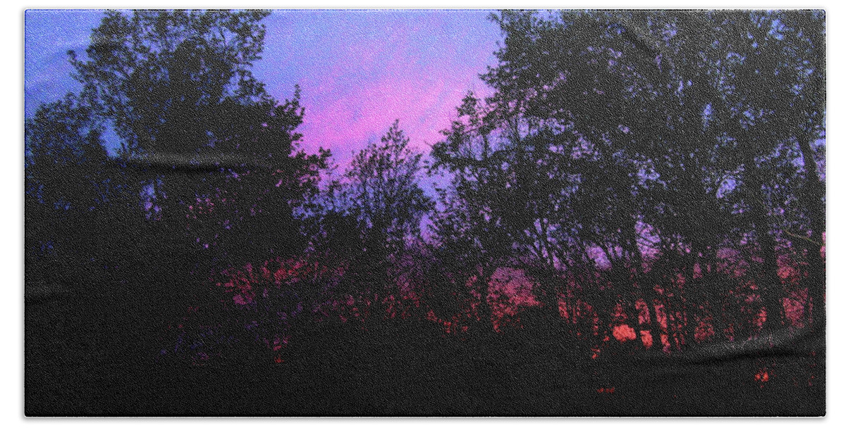 A Photo Of The Swirling Colors Of The Evening Sky With The Spring Trees Silhouetted In Front. Beach Towel featuring the photograph April Sunset by Melinda Dare Benfield