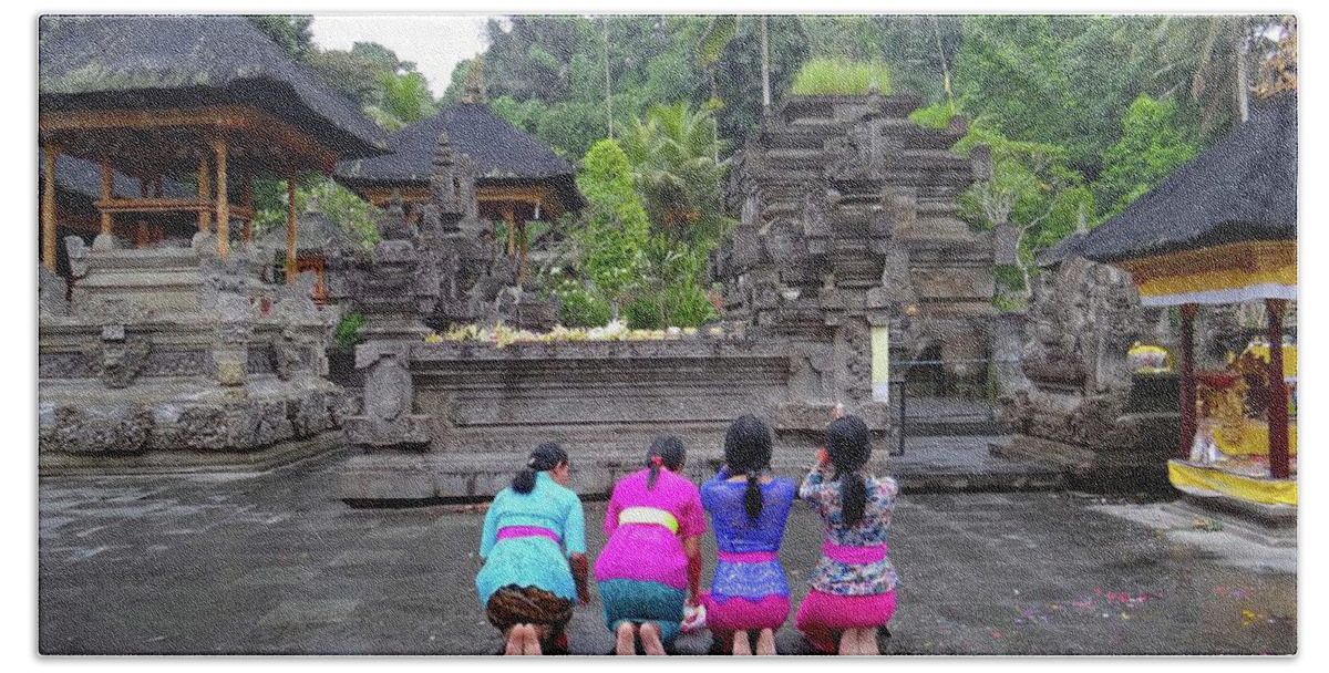 Exploramum Beach Towel featuring the photograph Bali temple women bowing by Exploramum Exploramum