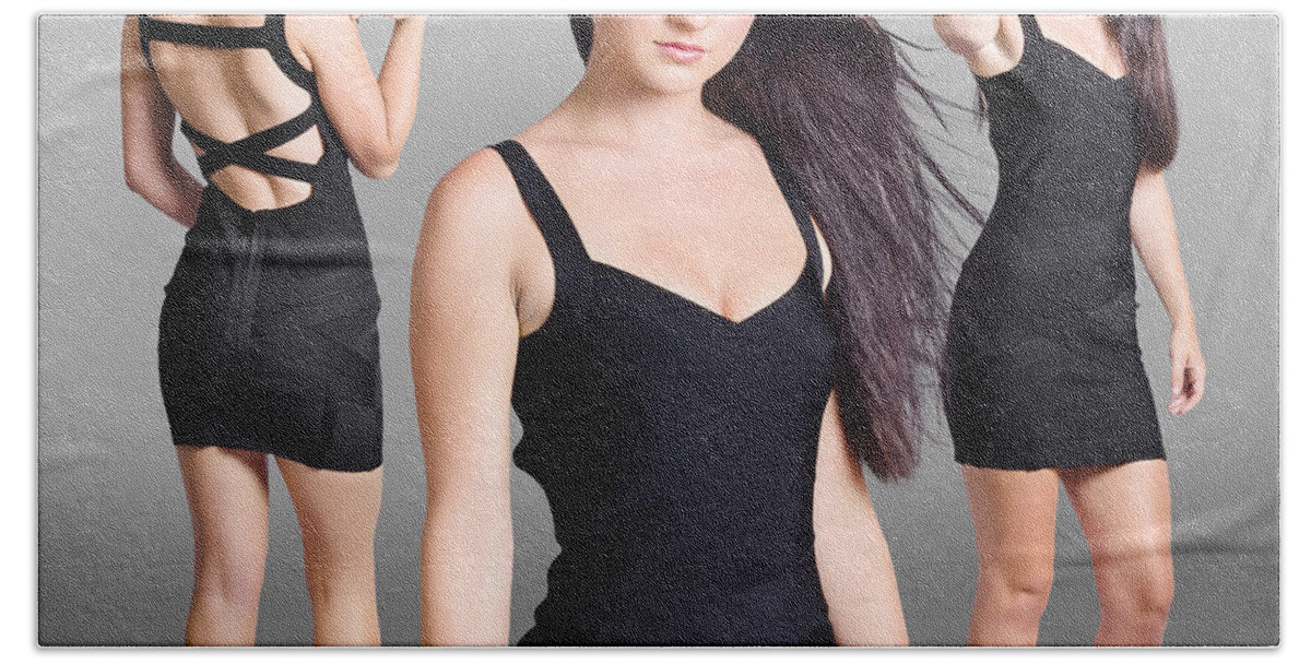 Fashion Beach Towel featuring the photograph Beautiful young woman showcasing black dress by Jorgo Photography