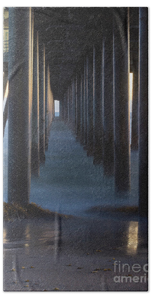  Huntington Beach Beach Towel featuring the photograph Between The Pillars by Brandon Bonafede