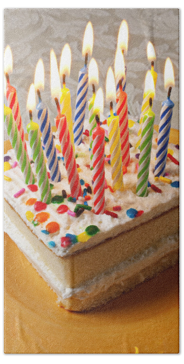 Flame Beach Towel featuring the photograph Candles on birthday cake by Garry Gay
