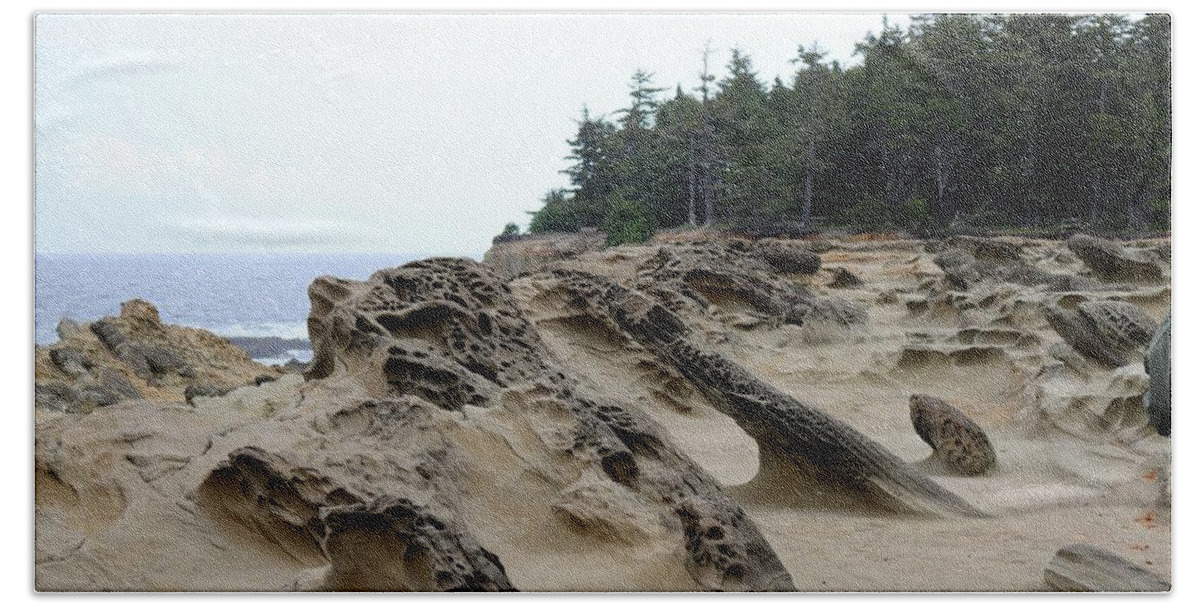Oregon Beach Towel featuring the photograph Carved Sandstone along the Oregon Coast by Christy Pooschke