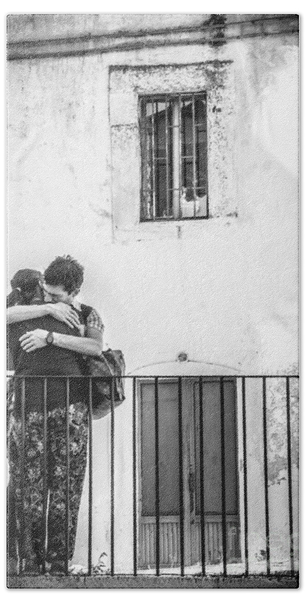 Monte Sant Angelo Beach Towel featuring the photograph Couple Of Guys Hugging Leaning On A Railing - Black And White With Vignetting by Luca Lorenzelli