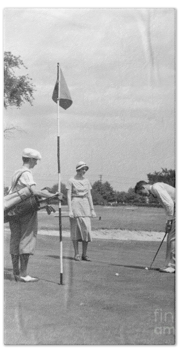 1930s Beach Towel featuring the photograph Couple Playing Golf, C.1930s by H. Armstrong Roberts/ClassicStock