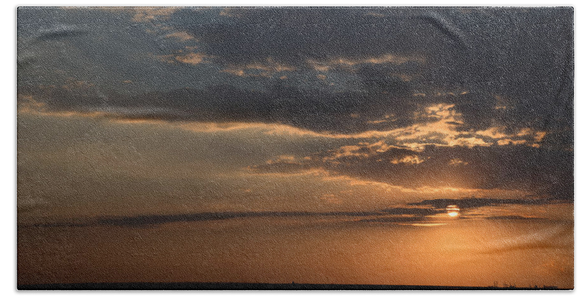 Sunset Beach Towel featuring the photograph Dramatic sunset over the ocean by Michalakis Ppalis