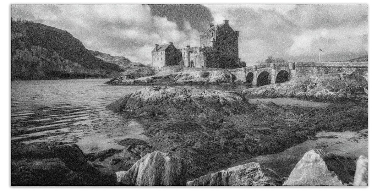 Eilean Donan Beach Towel featuring the photograph Eilean Donan Castle in black and white by Holly Ross