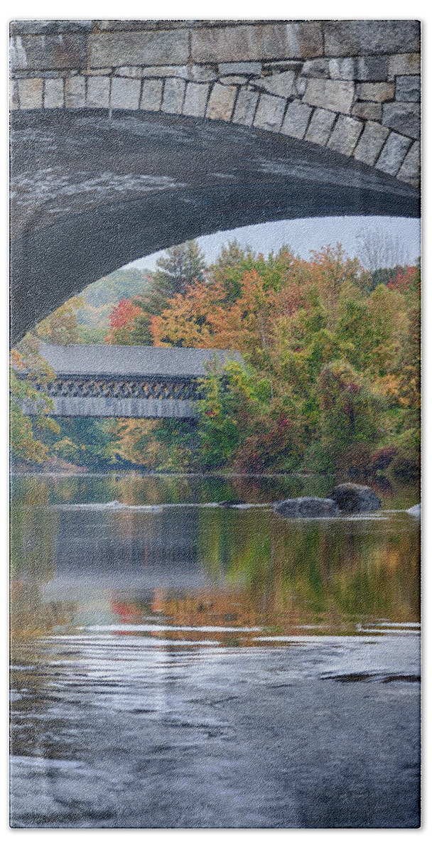  Beach Towel featuring the photograph fall colors over Henniker covered bridge by Jeff Folger