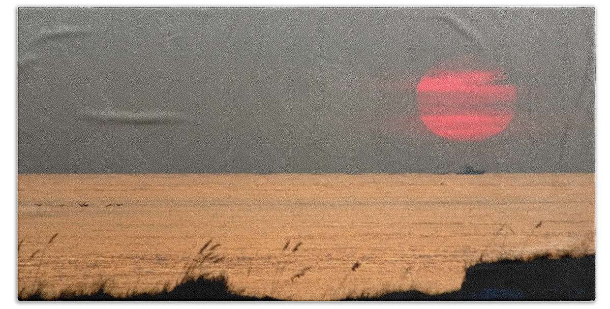 Sun Set Beach Towel featuring the photograph Fishing Boat Under Setting Sun by John Harmon