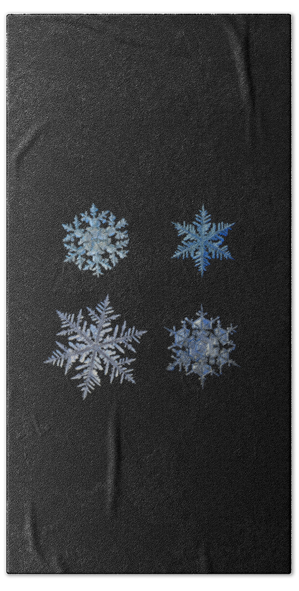 Snowflake Beach Sheet featuring the photograph Four snowflakes on black background by Alexey Kljatov
