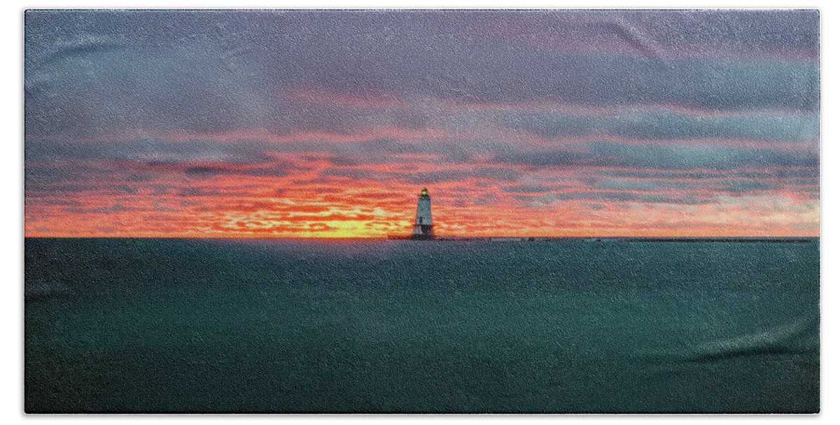 Ludington Mi Beach Towel featuring the photograph Glowing Sunset on Lake With Lighthouse by Lester Plank