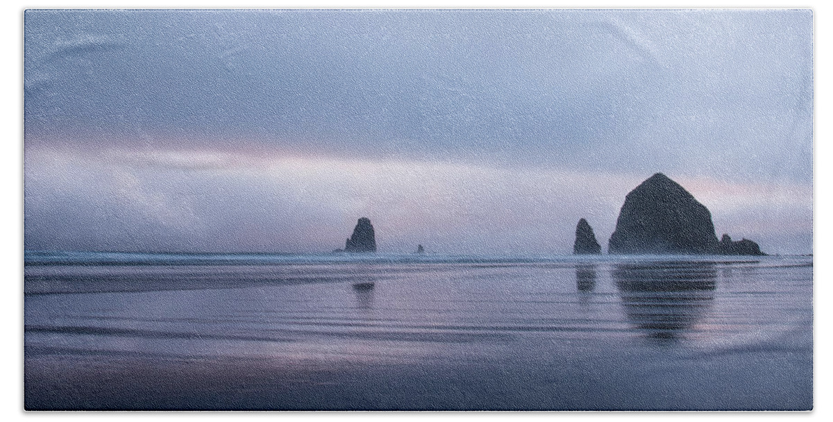 Cannon Beach Beach Towel featuring the photograph Haystack and the Needles by Don Schwartz