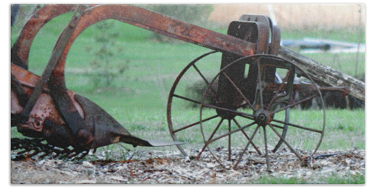 Antique Farm Equipment Beach Towel featuring the photograph In The Rust Home by Wild Thing