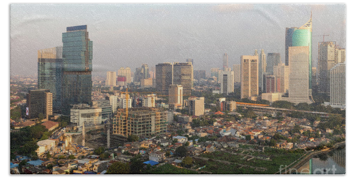 Capital Cities Beach Sheet featuring the photograph Jakarta urban skyline in Indonesia by Didier Marti