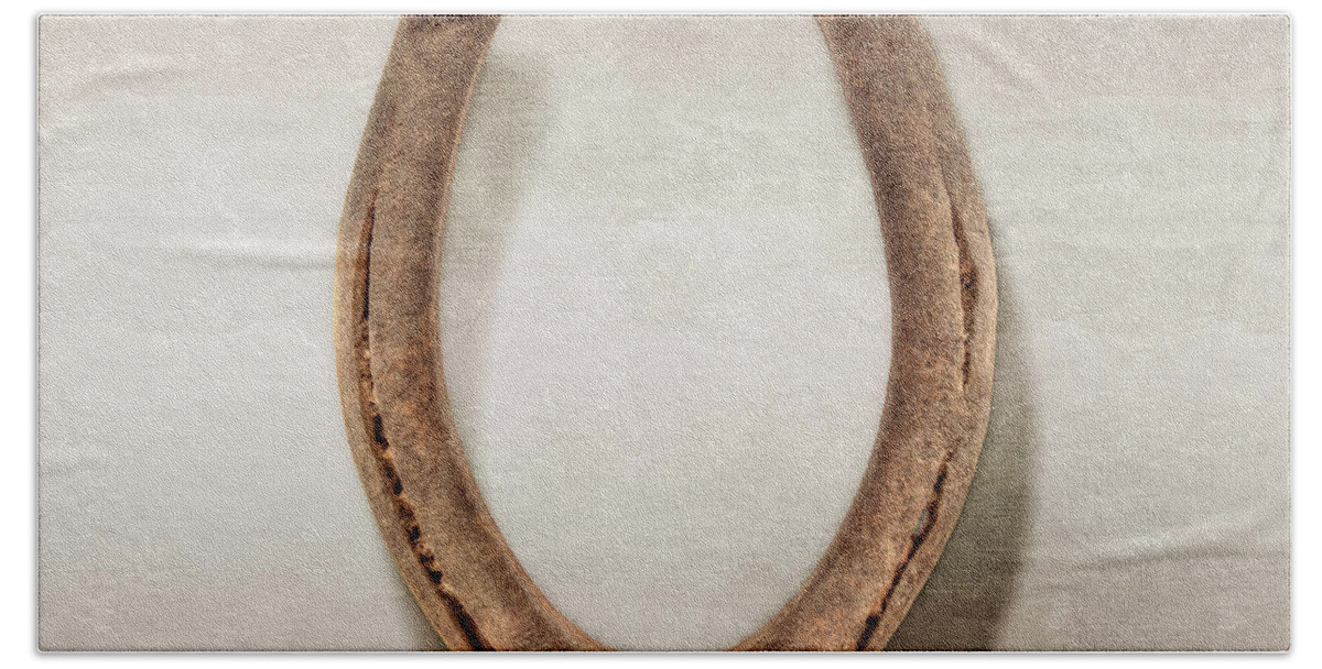 Iron Beach Towel featuring the photograph Lucky Horseshoe by YoPedro