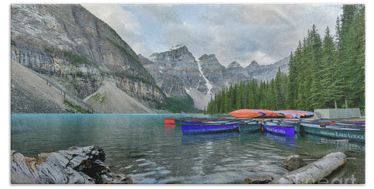 Moraine Lake Beach Towel featuring the photograph Moraine logs and canoes by Paul Quinn