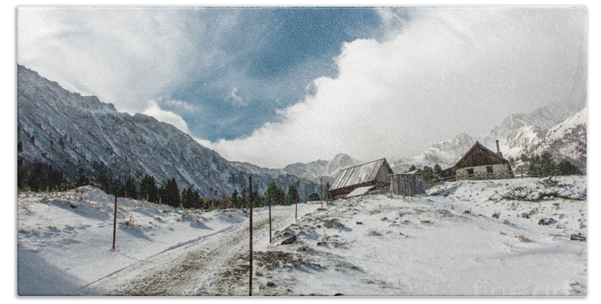 Winter Beach Towel featuring the photograph Mountain Hut with Snow between High Mountains in Winter by Andreas Berthold