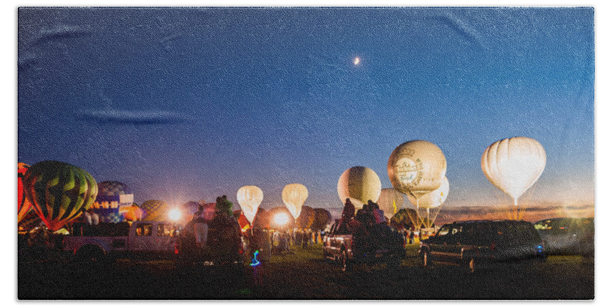 Multiple Hot Air Balloons Beach Towel featuring the photograph Multiple Hot air Balloons night glow by Charles McCleanon