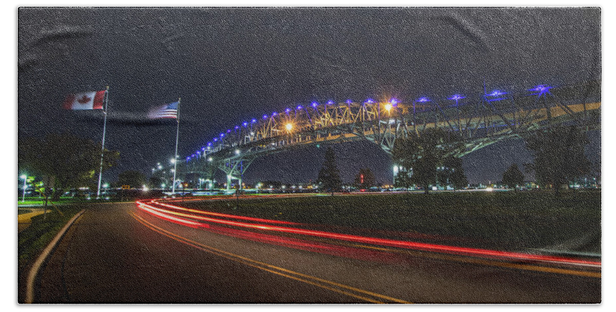 Port Huron Beach Towel featuring the photograph Nightly Neighbors at the Blue Water Bridge by Jay Smith