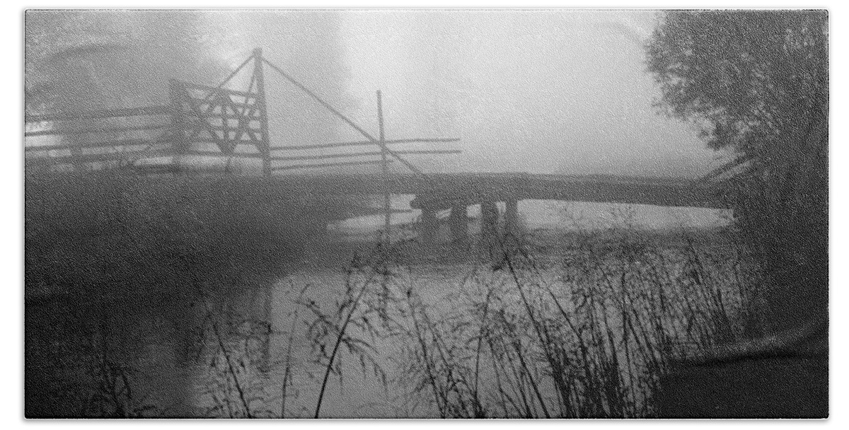 Part Of The Snake River Passes Under A Wooden Bridge Beach Towel featuring the photograph Part of the Snake River passes under a Wooden Bridge by Wernher Krutein