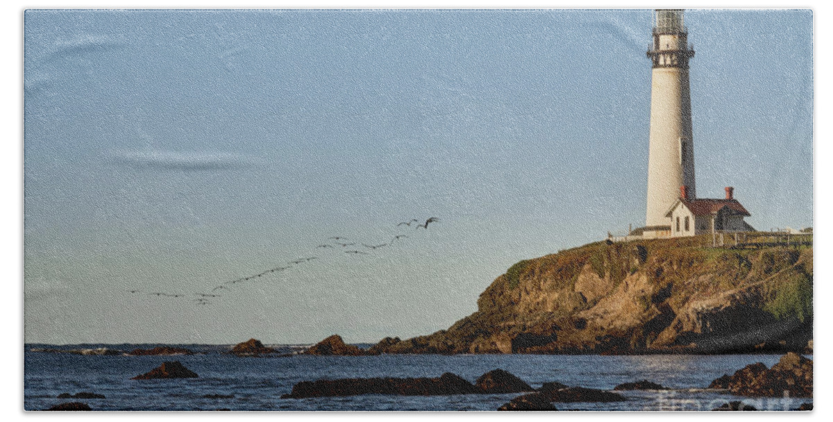 Architecture Beach Towel featuring the photograph Pigeon Point Light House with Pelican Flight by Dean Birinyi