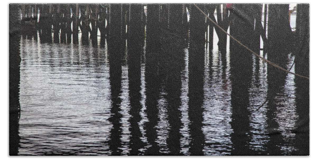 Charles Harden Beach Towel featuring the photograph Provincetown Wharf Reflections by Charles Harden
