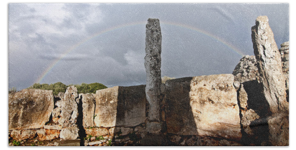 Nobody Beach Towel featuring the photograph Rainbow in human bronze age settlement in Minorca Island by Pedro Cardona Llambias