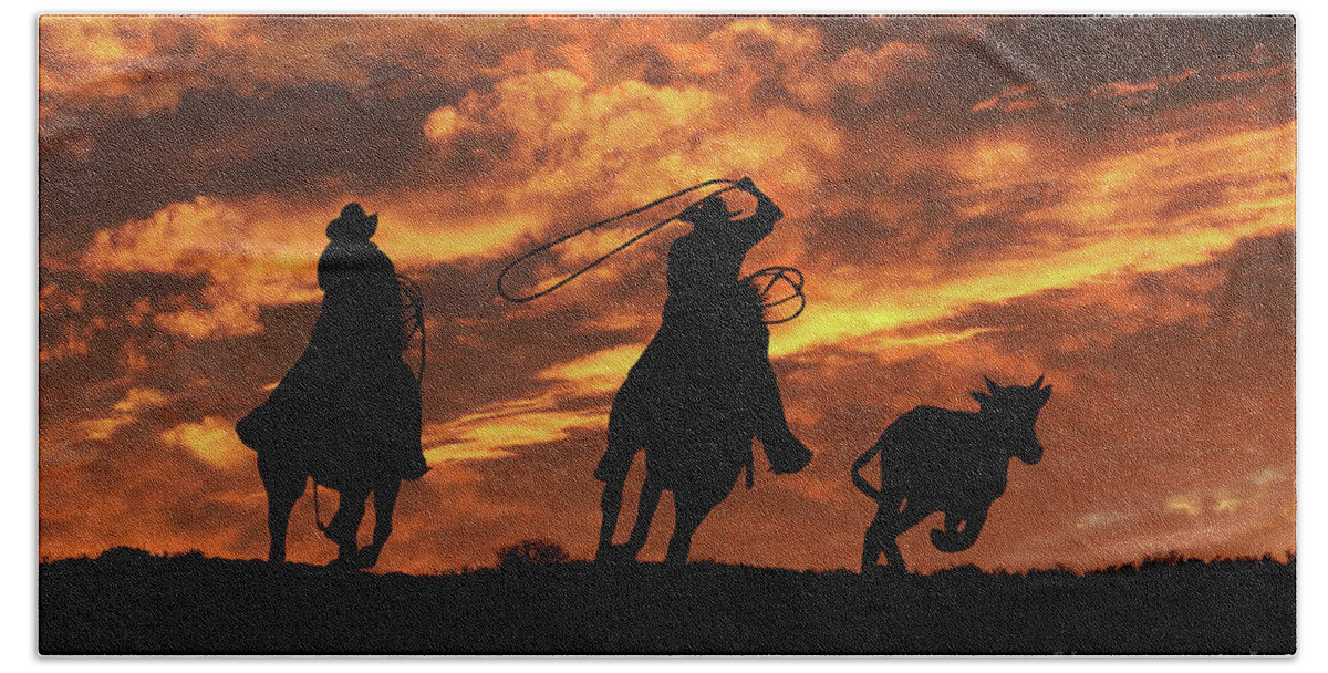 Western Beach Towel featuring the photograph Roping Cowboys and Fiery Skies by Stephanie Laird