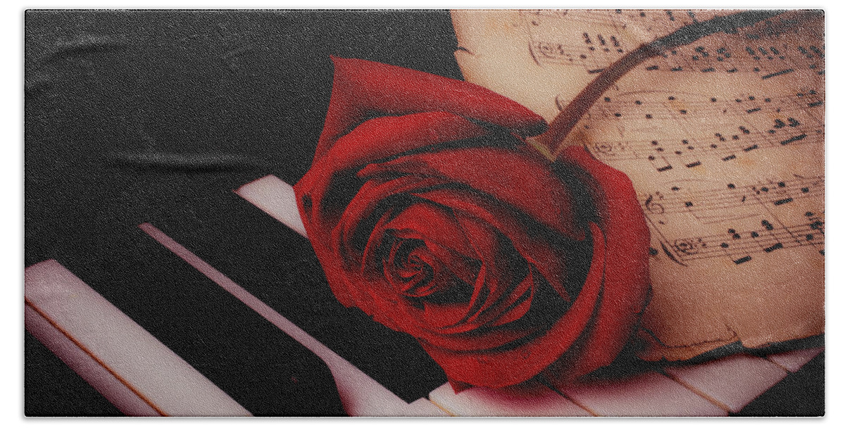 Red Rose Roses Beach Towel featuring the photograph Rose With Sheet Music On Piano Keys by Garry Gay