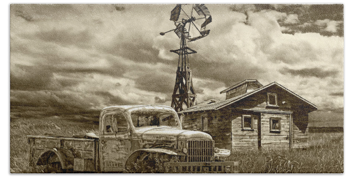 Landscape Beach Towel featuring the photograph Sepia Tone of Old Vintage Junk Dodge Pickup and Decaying Barn with Windmill by Randall Nyhof
