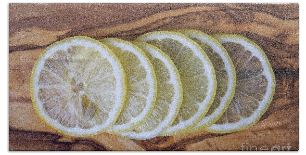 Lemons Beach Towel featuring the photograph Slices of lemon by Edward Fielding