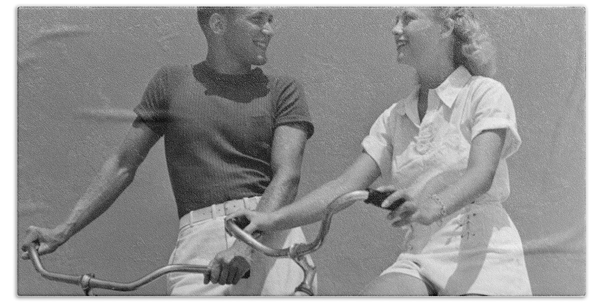1930s Beach Towel featuring the photograph Smiling Couple On Bikes, C.1930-40s by H. Armstrong Roberts/ClassicStock