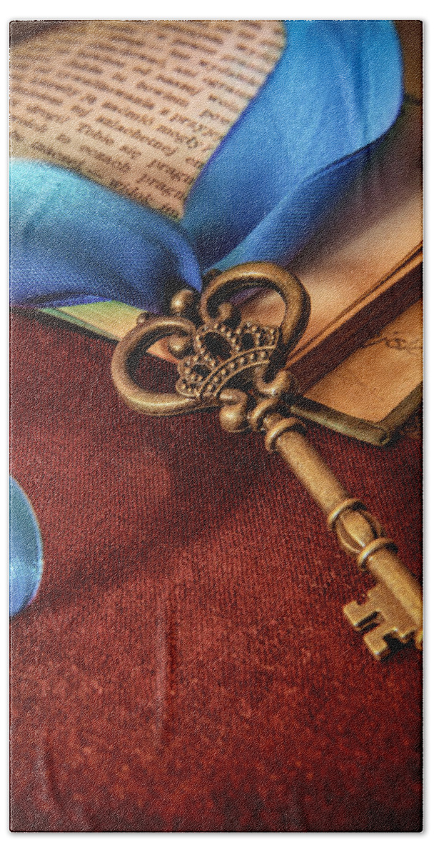 Ribbon Beach Towel featuring the photograph Still life with brass ornamented key and blue ribbon by Jaroslaw Blaminsky