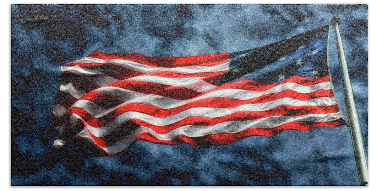 Storm Flag Beach Towel featuring the photograph Storm Flag Against A Stormy Sky at Fort McHenry by Bill Swartwout