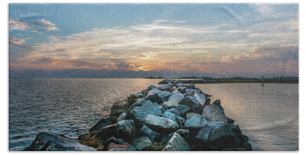 Rocks Beach Towel featuring the photograph Sunset over a rock jetty on the Chesapeake Bay by Patrick Wolf