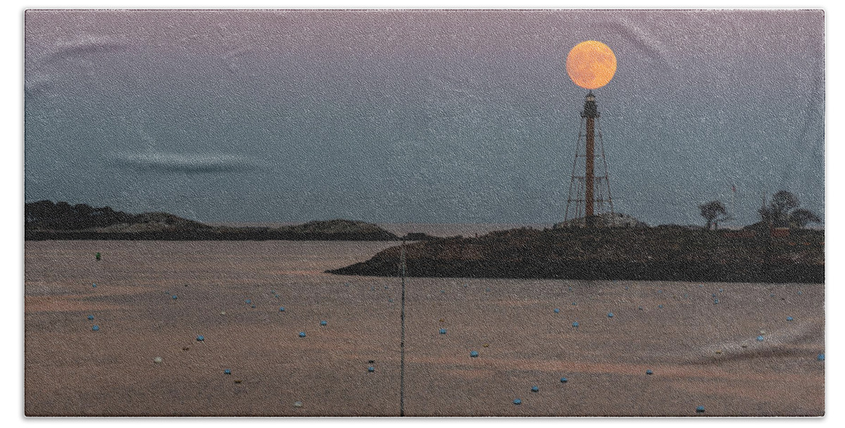 Marblehead Beach Towel featuring the photograph The 2016 Supermoon balancing on the Marblehead Light Tower in Marblehead MA by Toby McGuire