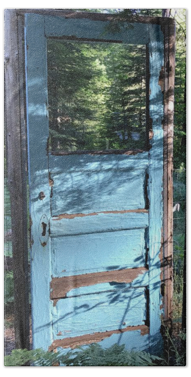 Secret Garden Beach Towel featuring the photograph The Blue door secret garden by Dottie Visker