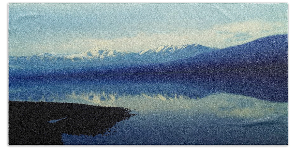 Mountains Beach Towel featuring the photograph The resounding stillness by Jeff Swan